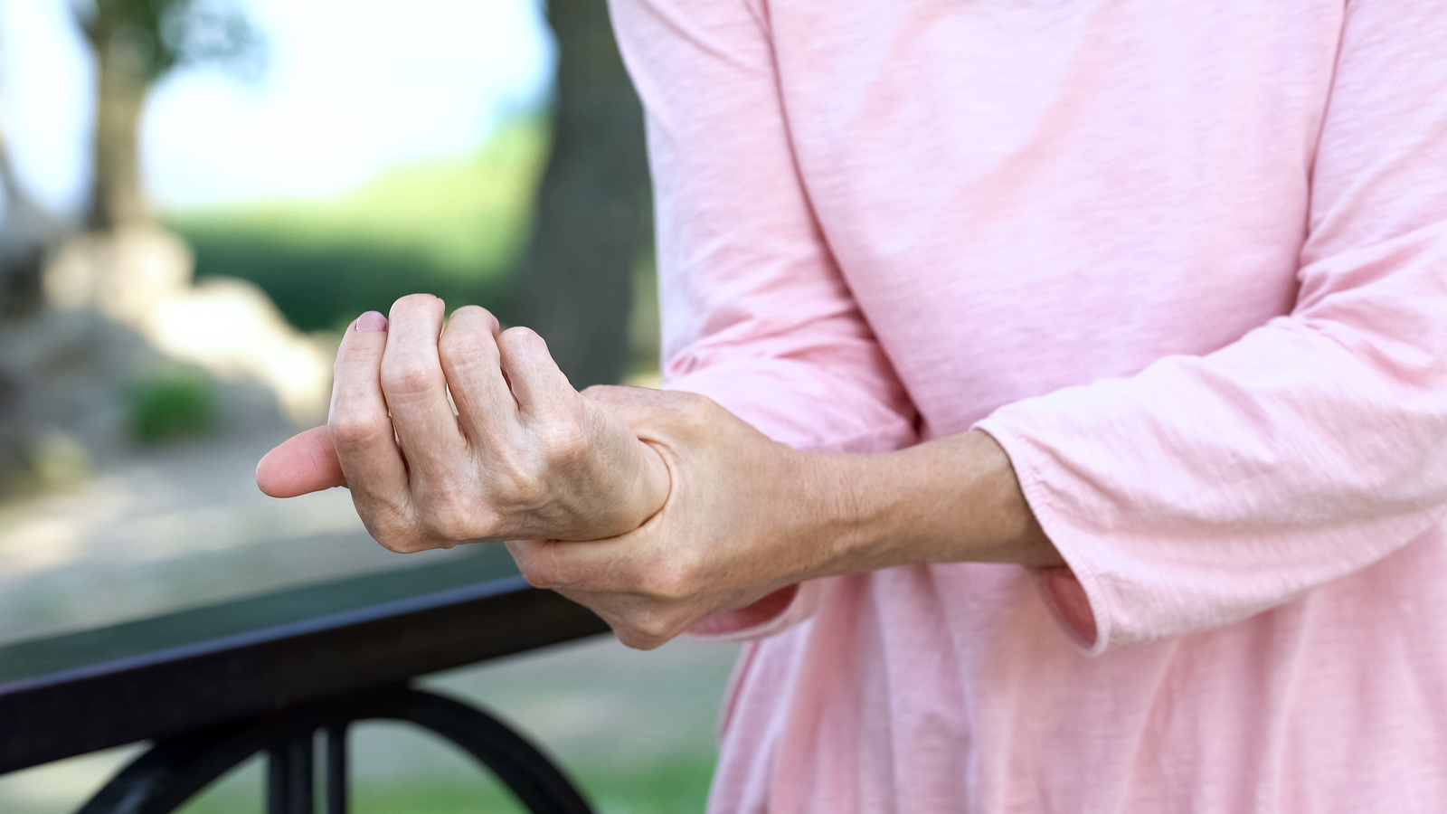 Old Woman Stretching Numb Arm, Weakness Of Muscles In Senior Age