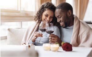 A couple enjoying their time over glasses of wine.